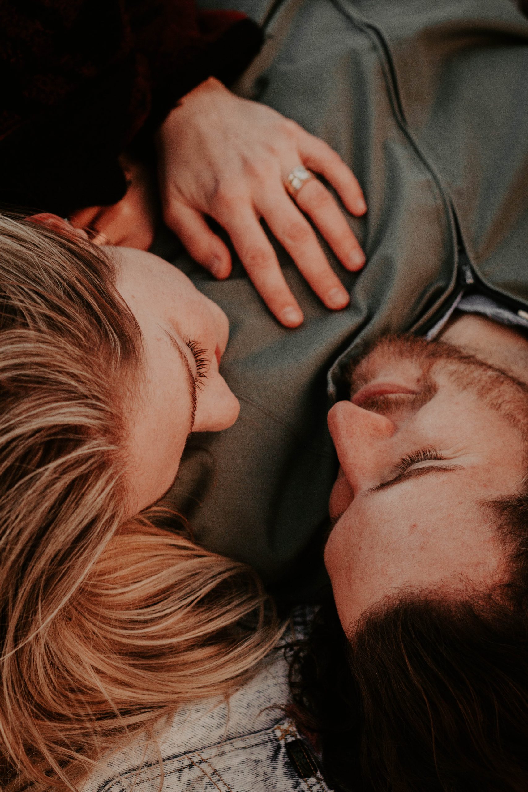 Lighthouse family therapy - couple hugging each other while lying down